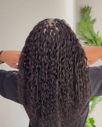 Boho knotless braids with soft curly pieces from root to tip