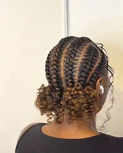 Feed-in cornrows with curled ends at the nape