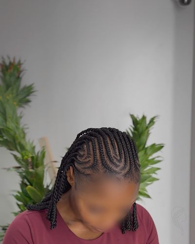 Fulani braids combining feed-in cornrows with individual twists